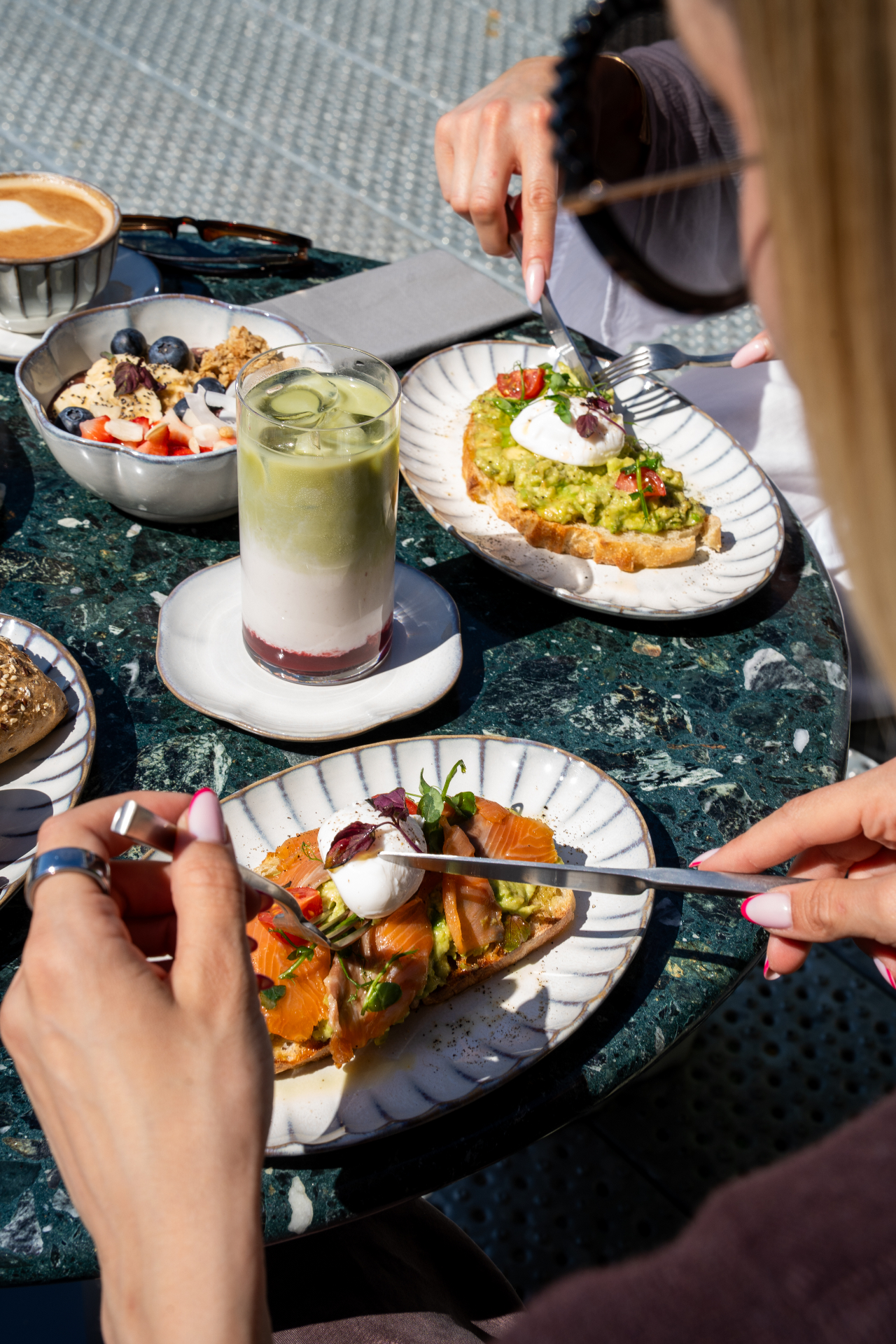 Guests sharing brunch dishes at Cafe Gaia